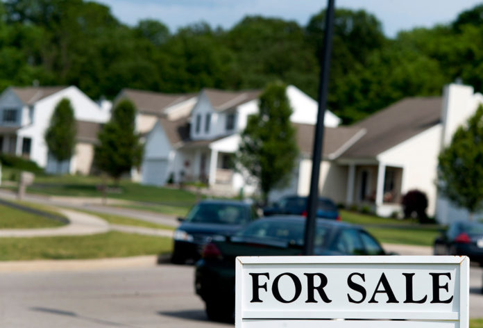 JULY HOME SALE prices hit a new record high for the month. / BLOOMBERG FILE PHOTO/TY WRIGHT JULY SINGLE-FAMILY HOME prices hit a record high in Massachusetts for the month, according to The Warren Group.