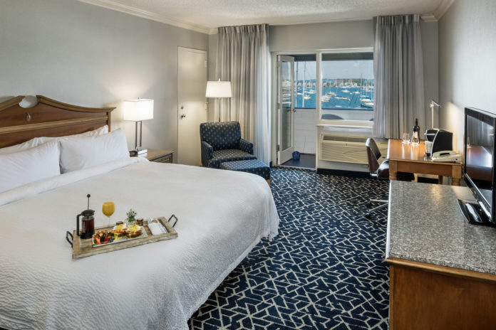 THE NEWPORT HARBOR Hotel and Marina recently completed a renovation and redesign of 133 guestrooms. The suite pictured above has a walkout and a view of Newport Harbor. /COURTESY AARON USHER III PHOTOGRAPHY