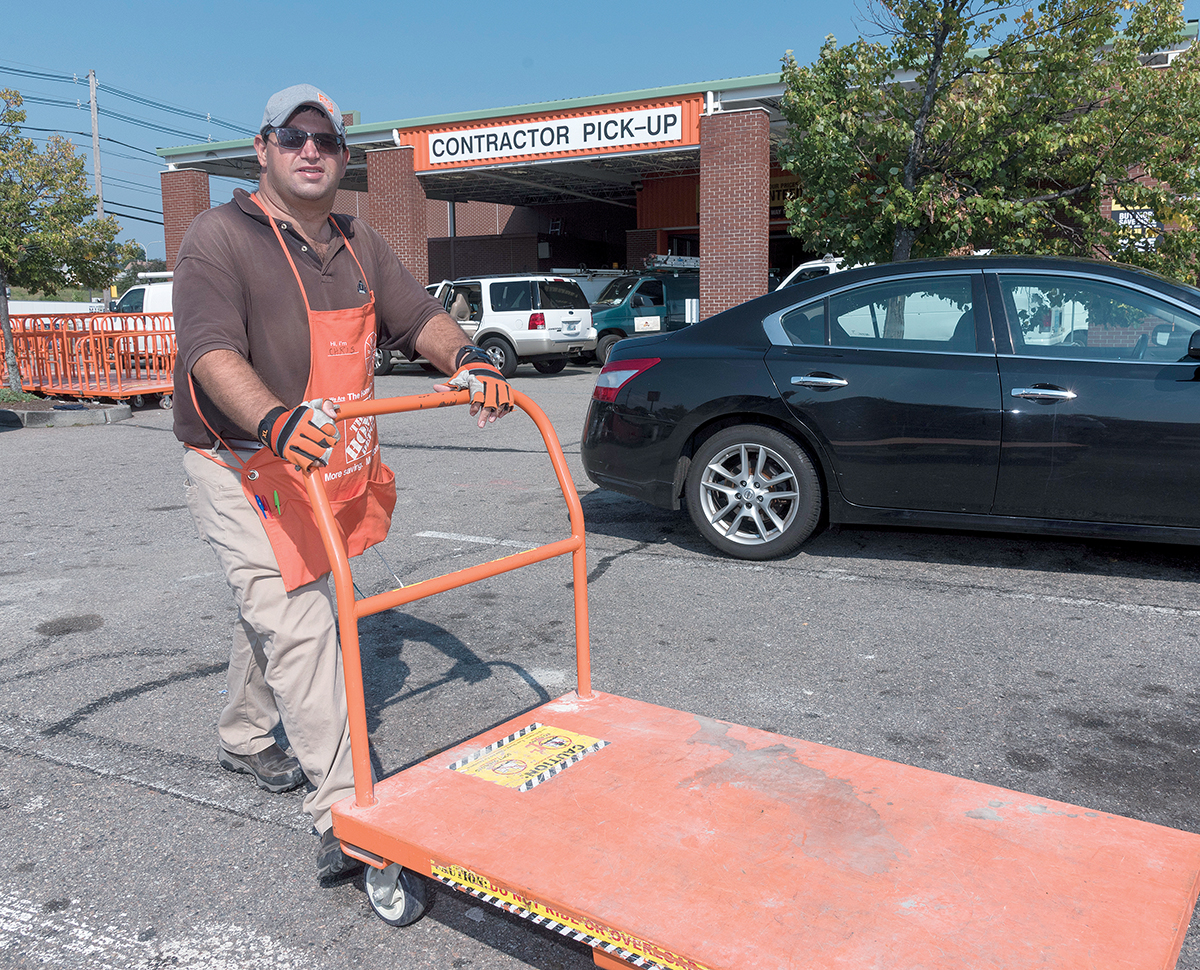 STORYTELLER: Chris Forte works part time at the Home Depot on Charles Street in Providence, where his responsibilities include retrieving carriages from the parking lot and assisting customers with loading heavy purchases into their cars and trucks. He enjoys telling stories and interacting with customers. / PBN PHOTO/MICHAEL SALERNO