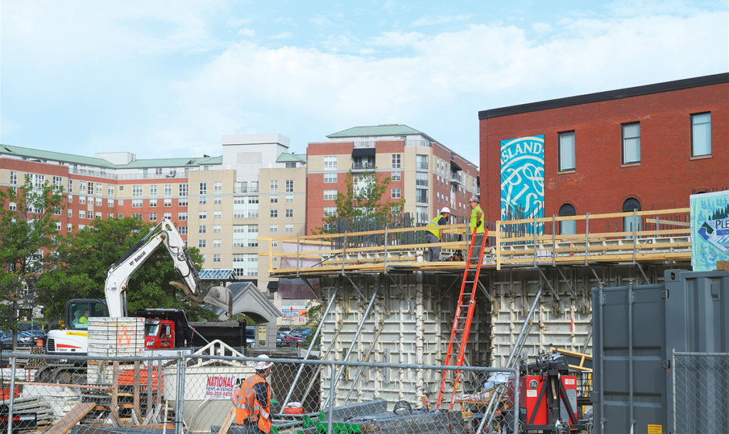 Edge College Hill  169 Canal St., Providence A blue crane towering over Canal Street marks the construction site of Edge College Hill, a mixed-use residential project being developed by Vision Properties with DBVW Architects Inc. What began as a parking lot at the base of College Hill near Rhode Island School of Design will be transformed into a 15-story, 123,000-square-foot building with first-floor commercial space and 202 micro-loft-style apartments, which will be primarily marketed toward students. Amenities for the residential units include a top-floor common room and southwest-facing terrace, as well as a fitness center and first-floor lobby and gathering space. Units will be fitted with oversized windows, 9-foot ceilings, fully equipped kitchens and fold-down beds that tuck into contemporary cabinetry when not in use. Engineers for the project are Odeh Engineers Inc., Wozny/Barbar & Associates Inc., and VHB, with GZA GeoEnvironmental Inc. Work is expected to be completed by July 2018. / PBN PHOTO/NICOLE DOTZENROD