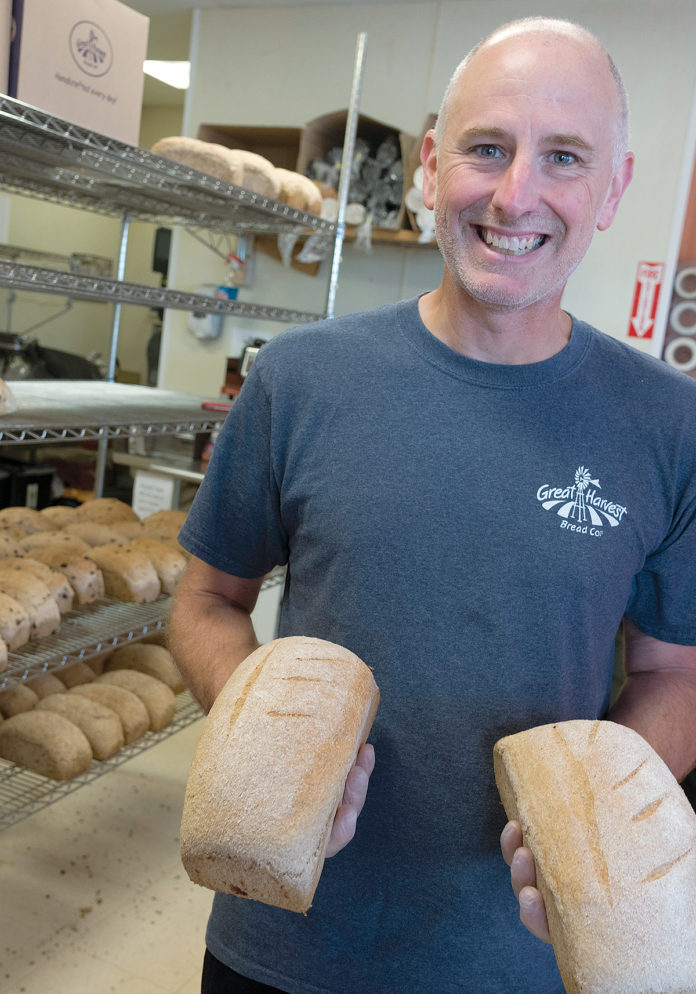 BAKER: Paul DiBiase splits his time working part time as a pharmacist and as a baker at his new franchise, Great Harvest Bread Co., in North Kingstown. / PBN PHOTO/MICHAEL SALERNO