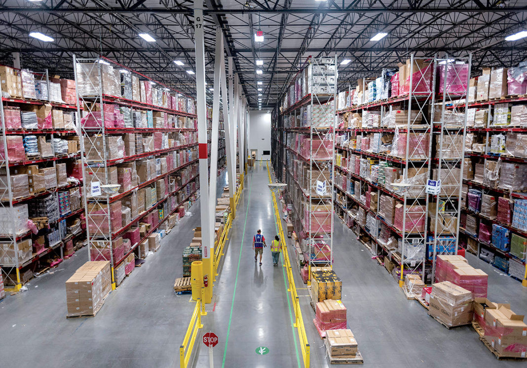 AGGRESSIVE GROWTH: Pictured is the interior of the Amazon fulfillment center in Fall River. According to retail analysts at Needham and Co. LLC, Amazon posted $128.5 billion in gross merchandise sales in 2016, 34 percent of all U.S. online sales, and accounted for 58 percent of all e-commerce growth in the country that year. / PBN PHOTO/MICHAEL SALERNO AGGRESSIVE GROWTH: Pictured is the interior of the Amazon fulfillment center in Fall River. According to retail analysts at Needham and Co. LLC, Amazon posted $128.5 billion in gross merchandise sales in 2016, 34 percent of all U.S. online sales, and accounted for 58 percent of all e-commerce growth in the country that year. / PBN PHOTO/MICHAEL SALERNO
