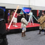HasCon attendees try their hand at lightsaber duels. PBN PHOTO/NICOLE DOTZENROD