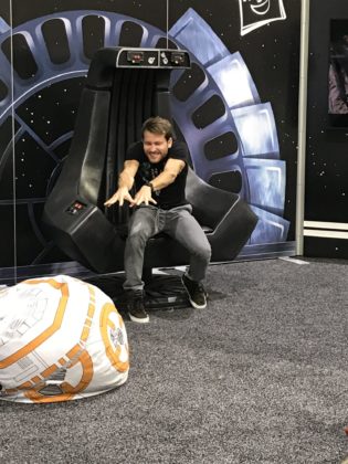 A Star Wars fan attempts to use the force to move a BB-8 beanbag at HasCon on Friday. PBN PHOTO/NICOLE DOTZENROD