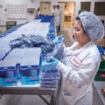 WHAT A RELIEF: Life Wear Technologies staffer Rafaela Hernandez packs CryoMax products at the company’s North Kingstown facility. The company is expanding its distribution to Japan and Mexico. / PBN PHOTO/MICHAEL SALERNO