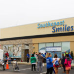 Southcoast Smiles hosts 10th annual Dentistry from the Heart VOLUNTEERS AND DENTAL professionals welcome participants at the 2015 Southcoast Smiles Dentistry from the Heart event. The organization will hold its 10th annual event on Sept. 30. / COURTESY OF SOUTHCOAST SMILES