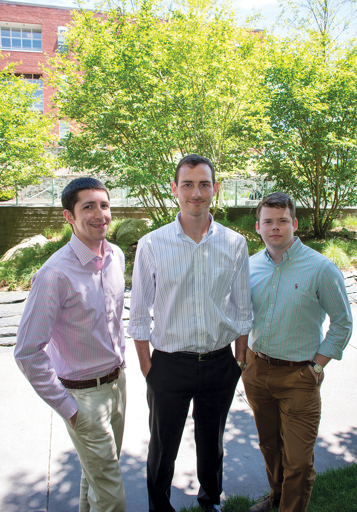 INSPIRED: From left, Nicholas DaSilva, Benjamin Barlock and Kenneth Rose, Ph.D. students at the University of Rhode Island’s College of Pharmacy, discuss the drug-development company they launched, Alcinous Pharmaceuticals. / COURTESY URI/NORA LEWIS