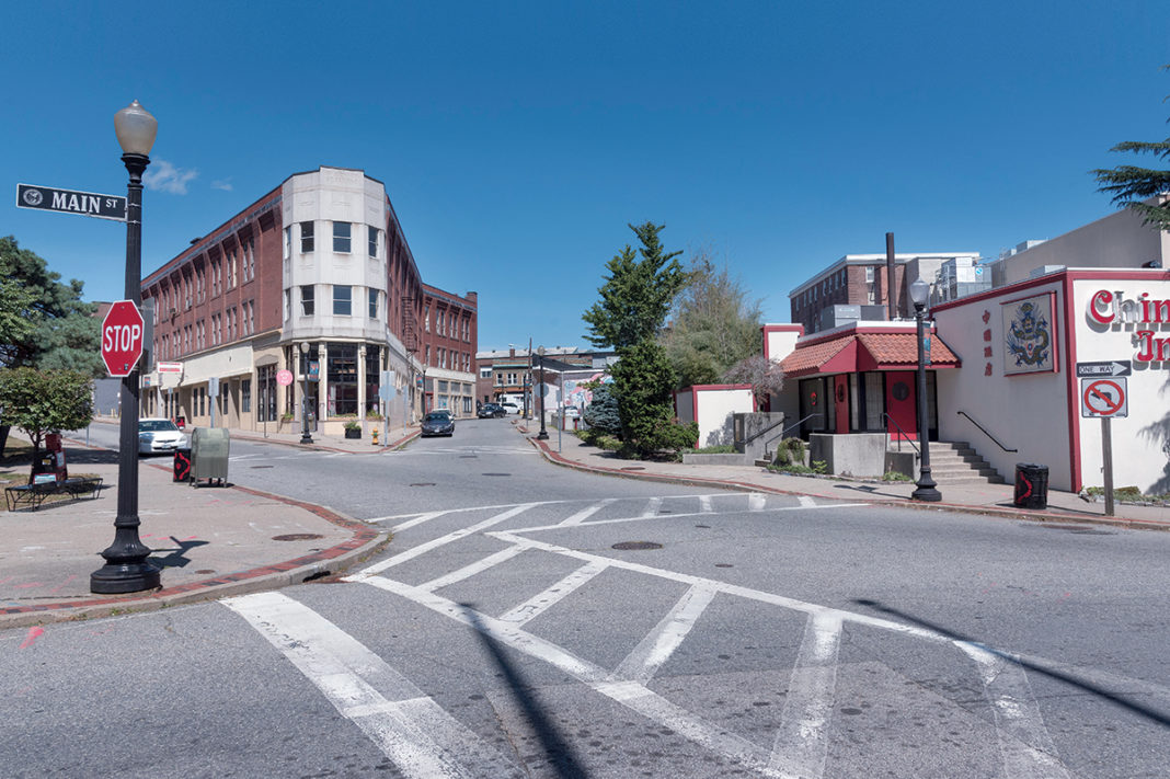 GHOST TOWN: With few shoppers or passersby on the sidewalks, even during weekday hours, Main Street in downtown Pawtucket resembles more of a ghost town than an active city center. City officials hope a new train station and a new ballpark for the Pawtucket Red Sox will lead to further development. / PBN PHOTO/MICHAEL SALERNO GHOST TOWN: With few shoppers or passersby on the sidewalks, even during weekday hours, Main Street in downtown Pawtucket resembles more of a ghost town than an active city center. City officials hope a new train station and a new ballpark for the Pawtucket Red Sox will lead to further development. / PBN PHOTO/MICHAEL SALERNO