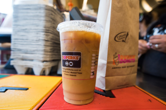 DUNKIN' BRANDS GROUP INC. reported a $52.2 million profit for the 2017 third quarter, a $500,000 decline year over year, but also reported an 8.2 percent increase in revenue for the quarter. / BLOOMBERG FILE PHOTO/RON ANTONELLI
