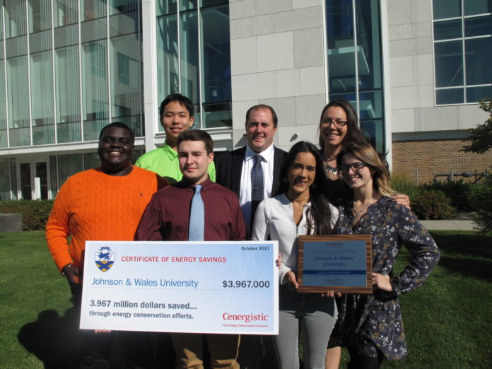JOHNSON & WALES UNIVERSITY has saved nearly $4 million through its energy-conservation efforts over the past four years. JWU Energy Conservation Office Manager Matthew Fannon, back row center, poses with students, from left, Justin Constant-Corbin (orange sweater); Taojun Gao (green shirt); John Markowski; Alejandra Merced (white shirt); Alexis Coccio (black shirt); and Cassidy Lanza, holding a check representing the savings. / COURTESY JOHNSON & WALES UNIVERSITY JOHNSON & WALES UNIVERSITY has saved nearly $4 million through its energy-conservation efforts over the past four years. JWU Energy Conservation Office Manager Matthew Fannon, back row center, poses with students, from left, Justin Constant-Corbin (orange sweater); Taojun Gao (green shirt); John Markowski; Alejandra Merced (white shirt); Alexis Coccio (black shirt); and Cassidy Lanza, holding a check representing the savings. / COURTESY JOHNSON & WALES UNIVERSITY