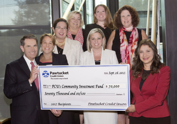 PAWTUCKET CREDIT UNION has started a new program, dubbed the Community Investment Fund, to support organizations serving “vulnerable populations” in the community. Above, PCU President and CEO George J. Charette, left, stands with recipients of the inaugural grants of the Community Investment Fund./ COURTESY PAWTUCKET CREDIT UNION