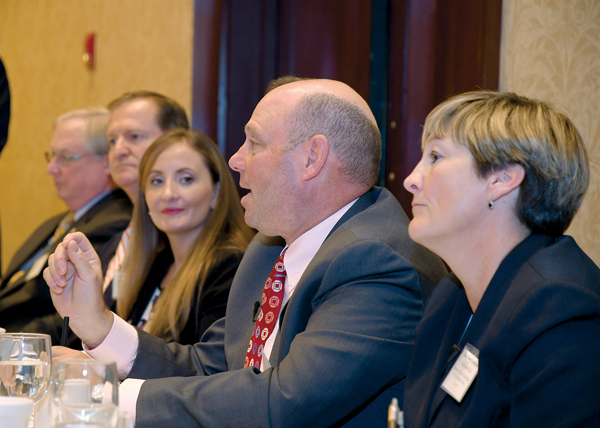 CYBER SOLUTIONS: Linn Foster Freedman, right, a partner with Robinson+Cole, looks on as Jeff Ziplow, center, ­cybersecurity risk assessment officer with BlumShapiro, answers a question during the PBN Cybersecurity Summit at the Crowne Plaza Providence-Warwick on Oct. 31. / PBN PHOTO/MICHAEL SKORSKI