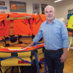 ONE-STOP SHOP: Jim O’Connor is the owner of Life Raft & Survival Equipment Inc. in Tiverton. The company not only sells protective gear to mariners but also maintains and inspects it, which is required yearly for commercial vessels. / PBN PHOTO/KATE WHITENEY LUCEY