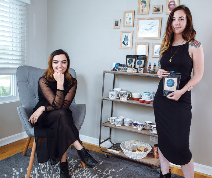 UNIQUE COLLABORATION: Viana Newton, left, and Katie Bouchard are co-owners of Providence-based beauty-products manufacturer PotionPVD, which has partnered with mobile coffee company The Nitro Cart to use its coffee beans in their beauty products. / PBN PHOTO/RUPERT WHITELEY UNIQUE COLLABORATION: Viana Newton, left, and Katie Bouchard are co-owners of Providence-based beauty-products manufacturer PotionPVD, which has partnered with mobile coffee company The Nitro Cart to use its coffee beans in their beauty products. / PBN PHOTO/RUPERT WHITELEY