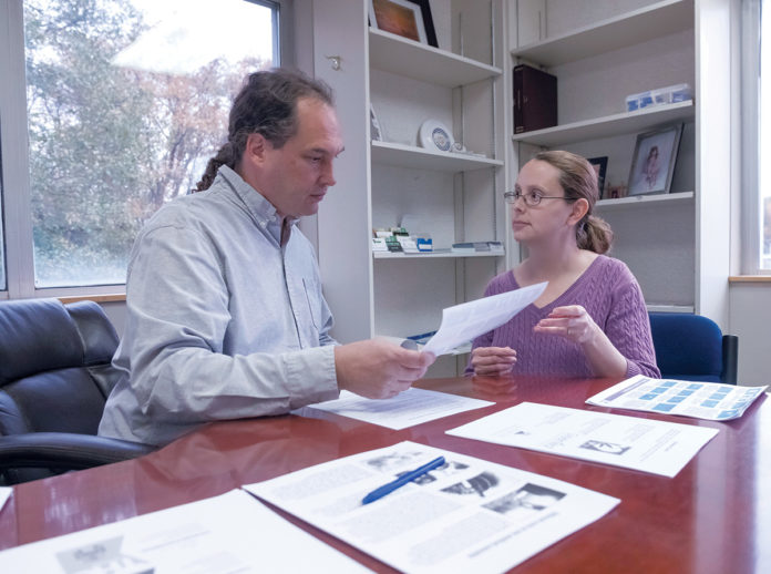 PAIN CLINIC: William and Jessica Cotton of B&B Medical Marijuana Evaluation Center in Warwick go over informational materials on marijuana. / PBN PHOTO/MICHAEL SALERNO PAIN CLINIC: William and Jessica Cotton of B&B Medical Marijuana Evaluation Center in Warwick go over informational materials on marijuana. / PBN PHOTO/MICHAEL SALERNO