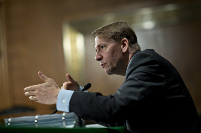 RICHARD CORDRAY, director of the Consumer Financial Protection Bureau will step down at the end of the month. / BLOOMBERG FILE PHOTO/ANDREW HARRER