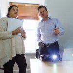 CONSTANTLY EVOLVING: Blair Fish and Yomaris Giboyeaux, digital media specialist, review a presentation at Fish Advertising’s East Greenwich office.    / PBN PHOTO/RUPERT WHITELY