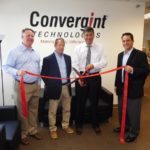 Convergint expansion to include Rhode Island markets CONVERGINT TECHNOLOGIES, a leader in security- and fire-systems integration, opened the Convergint Technology Center in Sharon, Mass., to expand in Rhode Island and other Northeastern states. From left, at the ribbon-cutting ceremony, are Tom O’Rourke and Brian Johnson of Neponsett Valley Chamber of Commerce in Massachusetts; and from Convergint, Jim Maymon, area general manager, New England, and Sean Flint, executive vice president, Eastern operation. /COURTESY CONVERGINT