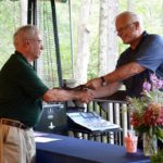 RUDI HEMPE, left, of North Kingstown accepts the award for University of Rhode Island Master Gardener of the Year from Charlie Junod during the Master Gardener 40th anniversary celebration. / COURTESY SUE DUNN