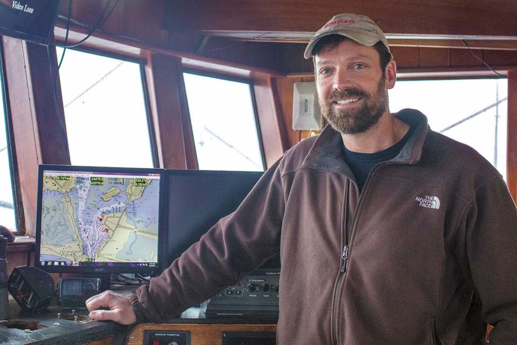HELPING HAND: Chris Roebuck, a Point Judith commercial fisherman who catches squid and scallops, is helping regulators conduct scientific studies to determine the efficiency of current methods used to count fluke populations. / PBN PHOTO/JOHN LEE