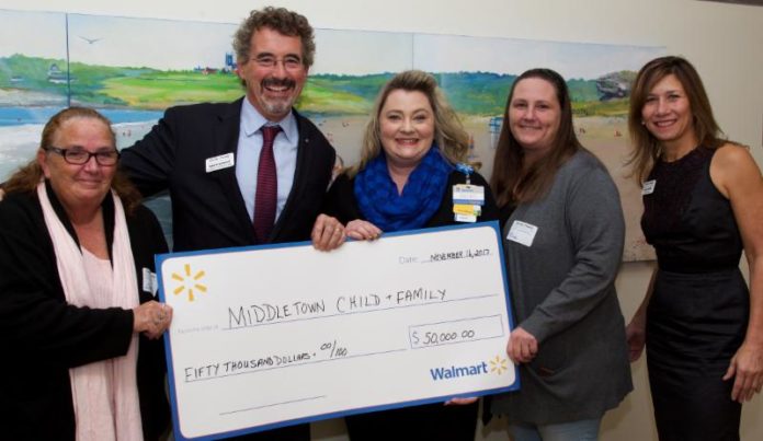 CHILD & FAMILY ACCEPTS $50,000 from the Walmart Foundation for its Supportive Housing program for homeless women and their children during the organization's 151st annual meeting on Nov. 16. From left: Donna Sousa, Walmart associate, Newport store; Marty Sinnott, Child & Family president and CEO; Becky Calvert, Walmart manager, Newport store; Tina O'Loughlin, Walmart associate, Newport store; and Sara Hiebner, vice chair, Child & Family board of directors. / COURTESY CHILD & FAMILY/KIM FULLER PHOTOGRAPHY