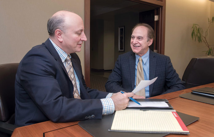 PARTNERS: From left, Emilio Colapietro of DiSanto, Priest & Co., and Steven Zaroogian, of Markarian & Meehan Ltd. The pair are managing partners of the two merging Rhode Island accounting firms. / PBN PHOTO/MICHAEL SALERNO PARTNERS: From left, Emilio Colapietro of DiSanto, Priest & Co., and Steven Zaroogian, of Markarian & Meehan Ltd. The pair are managing partners of the two merging Rhode Island accounting firms. / PBN PHOTO/MICHAEL SALERNO