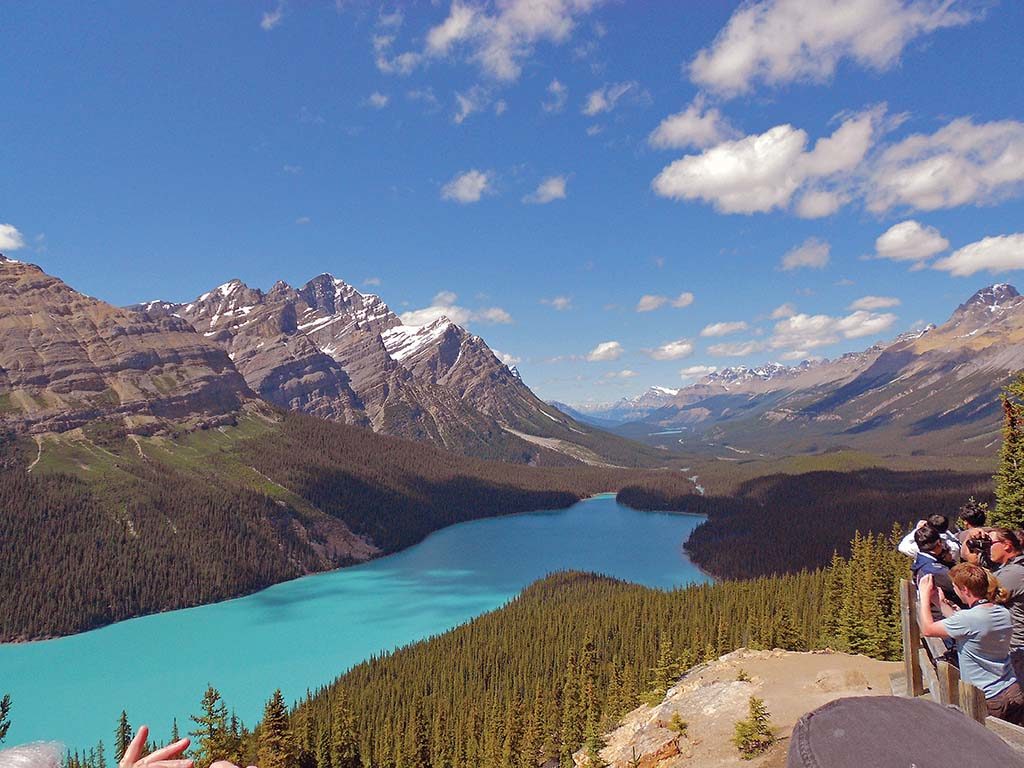 INTERNATIONAL TOUR: Visitors photograph the Canadian Rocky Mountains at Peyto Lake in Canada. The Canadian Rockies became Collette’s first international tour when it offered an air-and-land package to the region in 1976. / COURTESY COLLETTE