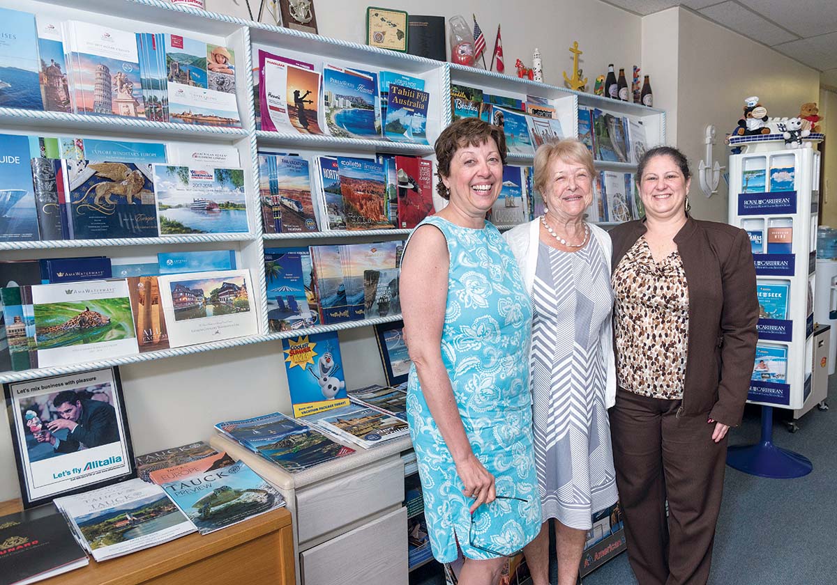 STILL GOING STRONG: From left, Colleen A. Keane, company manager at Anchor Travel Agency in Pawtucket; Nancy McAdams, owner and president; and Beverly J. Costello, travel consultant. Keane and ­McAdams have not completed a valuation and succession plan due to the emotion involved. / PBN FILE PHOTO/MICHAEL SALERNO