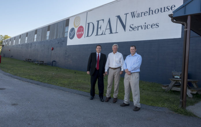 BRADFORD S. DEAN has been promoted to CEO and Joseph Iovini to President of Dean Warehouse Services, Inc. They are shown here, with company founder Bradford A. Dean, at the Warwick warehouse. From left, Joseph Iovini, president, Brad A. Dean, founder, and Brad S. Dean, CEO./ PBN FILE PHOTO/MICHAEL SALERNO BRADFORD S. DEAN has been promoted to CEO and Joseph Iovini to President of Dean Warehouse Services, Inc. They are shown here, with company founder Bradford A. Dean, at the Warwick warehouse. From left, Joseph Iovini, president, Brad A. Dean, founder, and Brad S. Dean, CEO./ PBN FILE PHOTO/MICHAEL SALERNO
