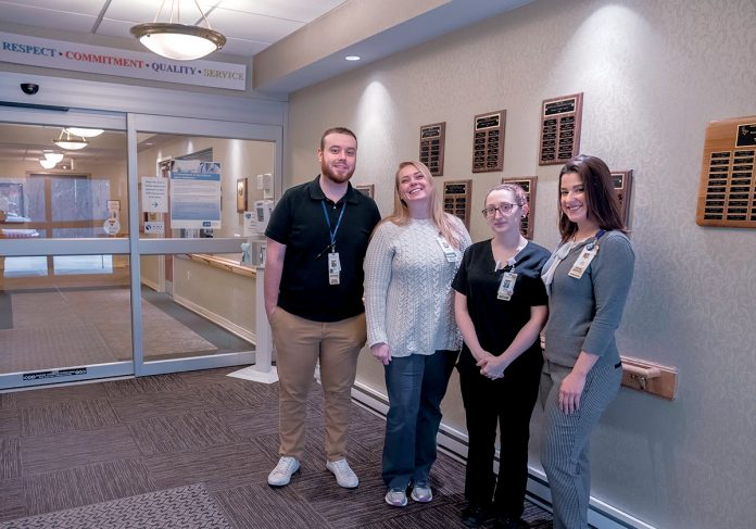 SAFE ZONE: Blue Cross & Blue Shield of Rhode Island has added West View Nursing & Rehabilitation Center in West Warwick to its growing list of LGBTQ Safe Zone certified providers. From left, Matthew Cooper, activities and social services; Pam Masciarott, social worker; Rachel Rodas, dietary aid; and Erica Lewis, social worker. / PBN PHOTO/­MICHAEL SALERNO