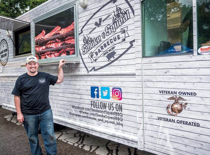 HOPEFUL: Adam Batchelder, owner of Smoke & Squeal BBQ food truck and a U.S. Marine Corps Reserve veteran, hopes a law passed last July requiring 3 percent of state government contracts be awarded to businesses owned by military veterans will boost his business. / PBN FILE PHOTO/MICHAEL SALERNO