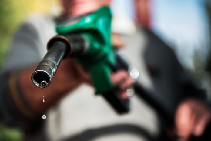 RHODE ISLAND REGULAR gasoline prices remained unchanged this week, hovering 3 cents above the national average, while Massachusetts gas prices rose 3 cents but remained 2 cents below the national average of $2.58 per gallon. / BLOOMBERG FILE PHOTO/AKOS STILLER