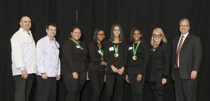 EAST PROVIDENCE CAREER & TECHNICAL CENTER'S team won the Food Service Management portion of the Seventh Annual Rhode Island ProStart High School Culinary & Management Competition. From left: Chef Ray McCue, Johnson & Wales University; Instructor Chef William Walker, East Providence Career & Technical Center; students Shelby Wilkerson, Sidney Robertson, Nayelle Vieira and Luana Rodrigues; Dale J. Venturini, president and CEO, Rhode Island Hospitality Association; and R.I. Speaker of the House Nicholas A. Mattiello. / COURTESY RHODE ISLAND HOSPITALITY EDUCATION FOUNDATION