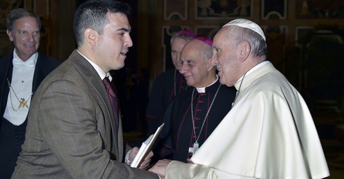 MIGUEL ROMERO, assistant professor of religious and theological studies at Salve Regina University in Newport, meets Pope Francis during a visit to Vatican City to present research. / COURTESY SALVE REGINA UNIVERSITY MIGUEL ROMERO, assistant professor of religious and theological studies at Salve Regina University in Newport, meets Pope Francis during a visit to Vatican City to present research. / COURTESY SALVE REGINA UNIVERSITY