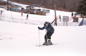 SLOPE RUN: A skier enjoys the slopes at Yawgoo Valley in Exeter. CEO Tracy Hartman says the park sees between 17,000 and 22,000 skiers in any given year. / PBN PHOTO/BRIAN MCDONALD