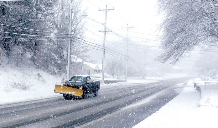 WINTER WONDERLAND? Tree-lined streets, such as Hopkins Hill Road in Coventry, look lovely with a cover of snow, but they can turn ugly when branches fall on overhead lines and interrupt power to homes and ­businesses.  / PBN PHOTO/ ROB BORKOWSKI