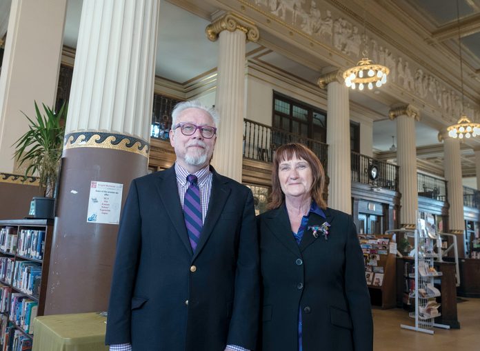 KNIGHT STEWARDS: Jeffrey Cannell, library director of the Providence Community Library network, and Sue Gibbs, chief operating officer, inside the Knight Memorial Library, which has received $544,800 from the Champlin Foundation to go toward much-needed renovations. / PBN PHOTO/MICHAEL SALERNO KNIGHT STEWARDS: Jeffrey Cannell, library director of the Providence Community Library network, and Sue Gibbs, chief operating officer, inside the Knight Memorial Library, which has received $544,800 from the Champlin Foundation to go toward much-needed renovations. / PBN PHOTO/MICHAEL SALERNO