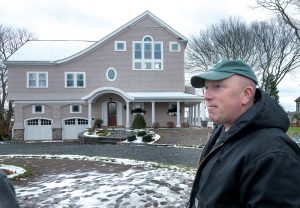 BUILDING BETTER: Dave Caldwell, owner of Caldwell & Johnson Inc. and head of the Rhode Island Builders Association, said the opportunity to build more resiliently is easier and less costly when building something new, as “it gets harder if the structure is already there and you have to move it up.” Caldwell stands in front of one of the homes his company built in North Kingstown. / PBN FILE PHOTO/MICHAEL SALERNO