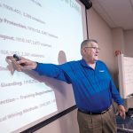 STANDING OUT: Gerry Marzilli, safety and training coordinator at Toray Plastics (America), gives a training session focusing on Occupational Safety and Health Administration safety notes from the previous year. / PBN PHOTO/MICHAEL SALERNO