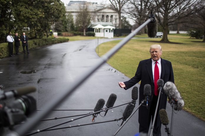 PRESDIENT DONALD TRUMP ADDRESSES the media before leaving the White House to address the Conservative Political Action Conference in the aftermath of the Lakeland, Fla., massacre. The president declared at the conference that declaring schools to be gun-free zones puts students in more danger and that well-trained gun-adept teachers and coaches should be able to carry concealed firearms. / BLOOMBERG NEWS PHOTO/ZACH GIBSON