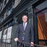 MICRO-LOFTS: Joseph R. Paolino Jr., managing partner of Paolino Properties, stands in front of the new Case-Mead Lofts building at 76 Dorrance St. The Case-Mead Lofts are a renovation of a former office building into 44 micro-loft apartments.  / PBN PHOTO/ MICHAEL SALERNO