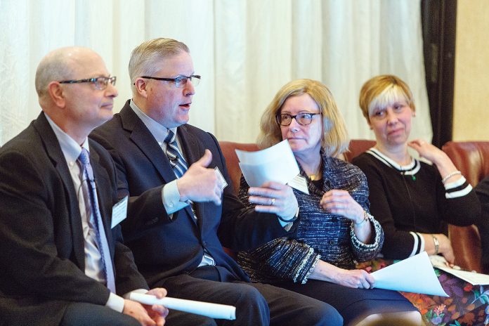 INSIDE KNOWLEDGE: Members of the first panel at the 2018 Spring Providence Business News Health Care ­Summit April 6 at the Providence Marriott Downtown: from left, Dr. Gus Manocchia of Blue Cross & Blue Shield of Rhode Island; Stephen Farrell, CEO of UnitedHealthcare of New England; Dr. Claire Levesque, board-certified neurologist and chief medical officer for commercial products at Tufts Health Plan; and Joan Kwiatkowski, CEO of CareLink and the PACE Organization of Rhode Island.  / PBN PHOTO/RUPERT WHITELEY