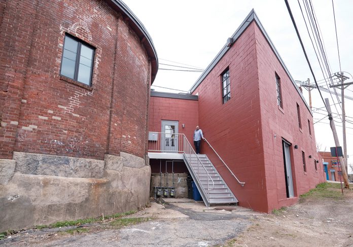 NECESSARY STEPS: On the building’s exterior, new stairs and a new entrance leading into the building were constructed in an alley in between the triangular building and the rotunda that was once fenced off. / PBN PHOTO/MICHAEL SALERNO NECESSARY STEPS: On the building’s exterior, new stairs and a new entrance leading into the building were constructed in an alley in between the triangular building and the rotunda that was once fenced off. / PBN PHOTO/MICHAEL SALERNO