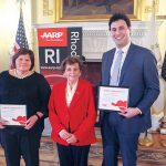CAPITOL CAREGIVERS: Sen. Maryellen Goodwin, left, and Rep. Aaron ­Regunberg, right, were named 2017 AARP Capitol Caregivers for their earned paid sick leave legislation passed last year. They are pictured with AARP Rhode Island Director Kathleen Connell holding their certificates. / COURTESY AARP