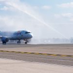 WELCOMING ALLEGIANT: A fire engine shoots a stream of water into the air in celebration of the first flight of Allegiant Air to T.F. Green Airport in September. / PBN PHOTO/MICHAEL SALERNO