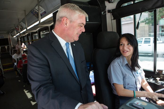 WARWICK MAYOR Scott Avedisian is a finalist candidate for RIPTA CEO. Above, Avedesian stands with RIPTA employee Deyrin Gonzalez. / PBN PHOTO/ RUPERT WHITELEY