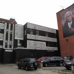 THE MURAL on the left is on the rear of the AS220 building downtown. At right, one of the portraits in the city-funded Seen Unseen grouping. /PBN FILE PHOTO/MARK S. MURPHY