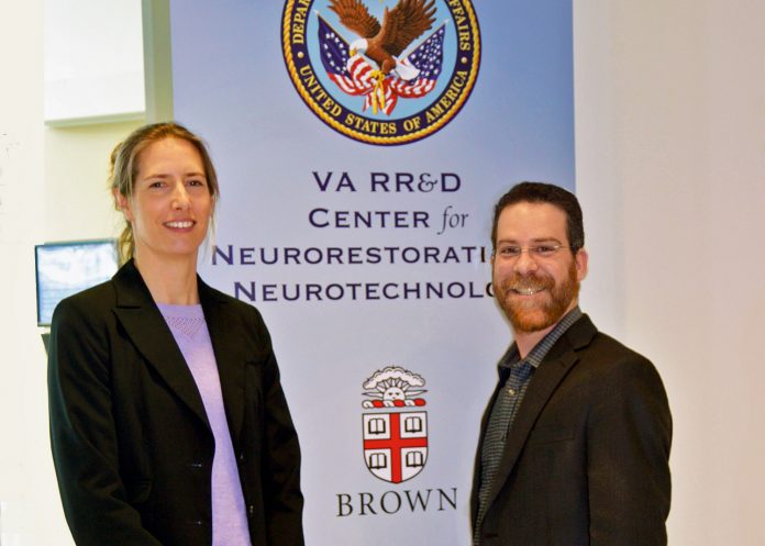DR. MASCHA van 't Wout-Frank, left, and Dr. Noah S. Philip at the VA Center for Neurorestoration and Neurotechnology located at the Providence VA Medical Center in Providence. The pair are leading a team of physicians and scientists from CFNN and Brown University investigating whether a small amount of electricity can improve post traumatic stress symptoms and improve quality of life when used to augment virtual reality therapy. / COURTESY PROVIDENCE VA MEDICAL CENTER/KIMBERLY DIDONATO