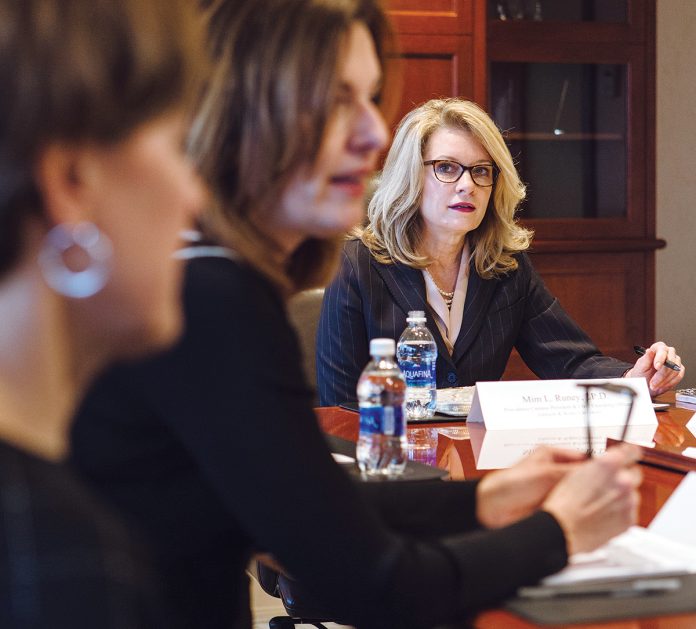 NOURISHING LESSONS: Mim L. Runey, right, Johnson & Wales University chief operating officer, hosts her cabinet meeting, which includes, from left, Diane D’Ambra, vice president of human resources, and Marie Bernando-Sousa, senior vice president of administration and enrollment management.  / PBN PHOTO/ RUPERT WHITELEY