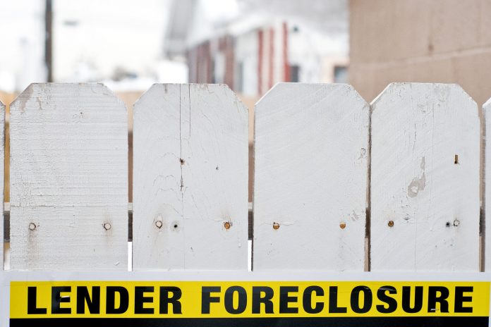MORTGAGE DELINQUENCY and foreclosure rates in Rhode Island as well as in the Providence-Warwick-Fall River metro area declined year over year in January, but remained above the national average. / BLOOMBERG FILE PHOTO/DAVID CALVERT